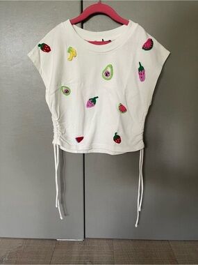 White Top with Handcrafted Fruit Appliqués and Ruched Detail